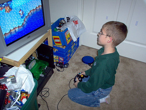 kid playing video game
